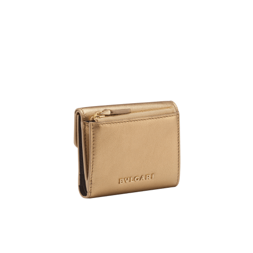 Serpenti Forever slim compact wallet in emerald green calf leather with black nappa leather interior. Captivating snakehead press button closure in light gold-plated brass embellished with black and white agate enamel scales and black onyx eyes. SEA-SLIMCOMPACT-Clb image 3