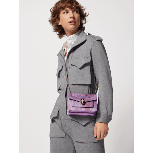 “Serpenti Forever” crossbody bag in rainbow-coloured "Spring Shade" python skin, with Lavender Amethyst lilac nappa leather inner lining. Tempting snakehead closure in gold-plated brass enhanced with lilac and white agate enamel and black onyx eyes. 1082-MK image 1