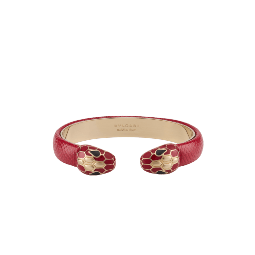 Serpenti Forever bangle bracelet in gold-plated brass with amaranth garnet pure karung inserts. Captivating contraire snakehead motif embellished with royal ruby enamel, gold-plated brass scales, and black enamel eyes. BRACLT-SP-CONTR-KAR image 1