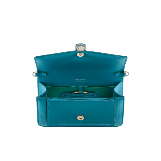 Serpenti Forever East-West small shoulder bag in black calf leather with emerald green grosgrain lining. Captivating snakehead magnetic closure in light gold-plated brass embellished with black and white agate enamel scales, and green malachite eyes. 1237-CLa image 4