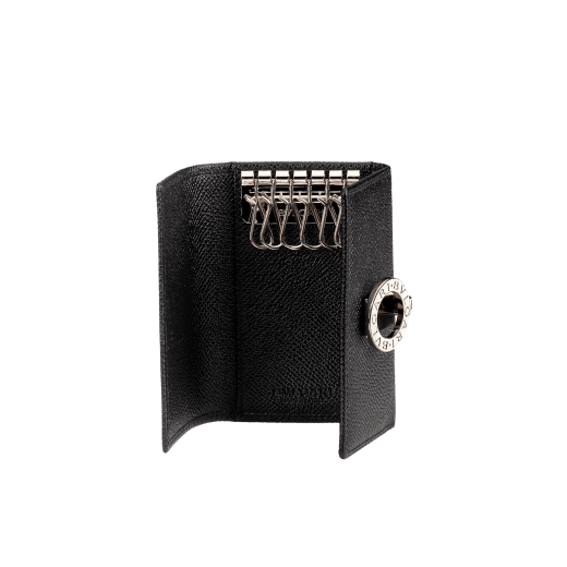 Black grain calf leather keyholder. Flap cover with clip and palladium plated hardware. Six internal keyholders. Dimensions: 2.8 x 3.9 (7 x 10 cm) 30422 image 1