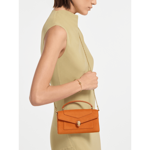 Serpenti Forever phone case in Terracotta nubuck leather. Captivating snakehead magnetic closure in gold-plated brass embellished with Terracotta enamel and gold-plated brass scales, and black onyx eyes. 295636 image 2