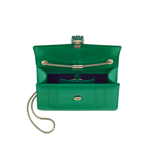 Serpenti Forever small crossbody bag in vivid emerald green calf leather with beet amethyst fuchsia grosgrain lining. Captivating snakehead magnetic closure in light gold-plated brass embellished with bright forest emerald green enamel and light gold-plated brass scales, and black onyx eyes. 422-CLe image 4