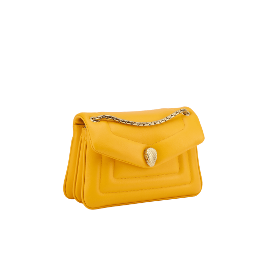 Serpenti Reverse small shoulder bag in ivory opal quilted Metropolitan calf leather with black nappa leather lining. Captivating snakehead magnetic closure in gold-plated brass embellished with red enamel eyes. 1244-MCL image 2