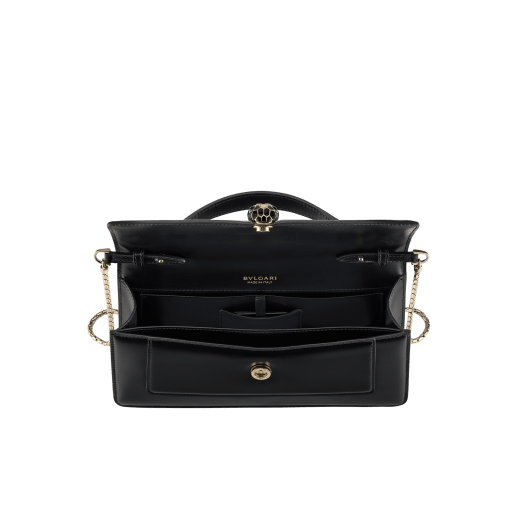 Serpenti Forever Elongated top handle bag in black calf leather with black nappa leather lining. Captivating snakehead magnetic closure in light gold-plated brass embellished with black enamel and light gold-plated brass scales, and black onyx eyes. SEA-001-1390S image 3