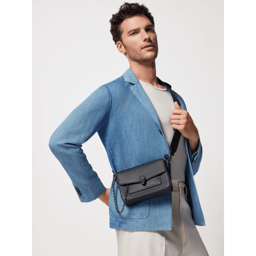 Serpenti Forever small unisex crossbody bag in matt black calf leather with black nappa leather lining and decorative chain. Captivating snakehead closure in dark ruthenium-plated brass embellished with red enamel eyes. 293022 image 8