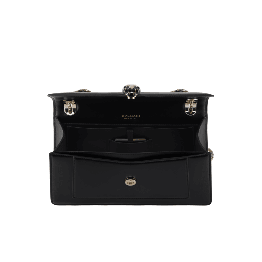 Serpenti Forever medium shoulder bag in black calf leather with black nappa leather lining. Captivating snakehead magnetic closure in light gold-plated brass embellished with beige noisette enamel and light gold-plated brass scales, and black onyx eyes. SEA-001-1344M image 3