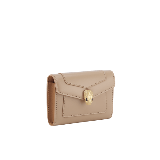 Serpenti Forever business card holder in travertine calf leather with a desert jasper nappa leather interior. Captivating snakehead press-button closure in gold-plated brass embellished with beige noisette enamel, and black enamel eyes. 295116 image 1