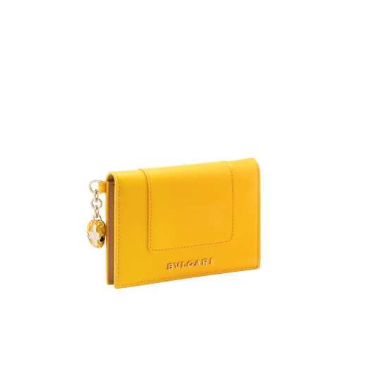 Serpenti Forever folded card holder in coral carnelian orange calf leather with flamingo quartz pink nappa leather interior. Captivating light gold-plated brass snakehead charm with red enamel eyes, and press-stud closure. SEA-CC-HOLDER-FOLD-CLb image 1