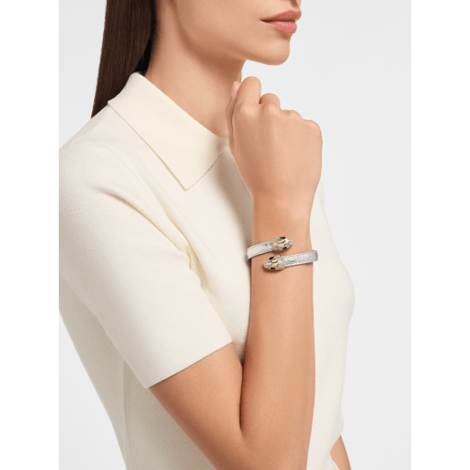Serpenti Forever soft bangle bracelet in silver Striated calf leather. Captivating contraire snakehead motif in light gold-plated brass embellished with brushed grey enamel and light gold-plated scales, and black enamel eyes. SERPSOFTCONTR-LG image 1