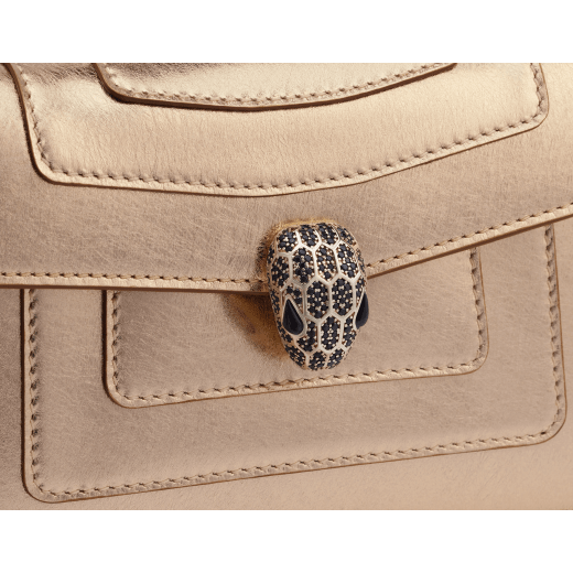 Serpenti Forever mini crossbody bag in light gold Striated calf leather with crystal rose nappa leather lining. Captivating snakehead magnetic closure in light gold-plated brass embellished with black zirconia pavé scales and black onyx eyes. 986-HS image 5
