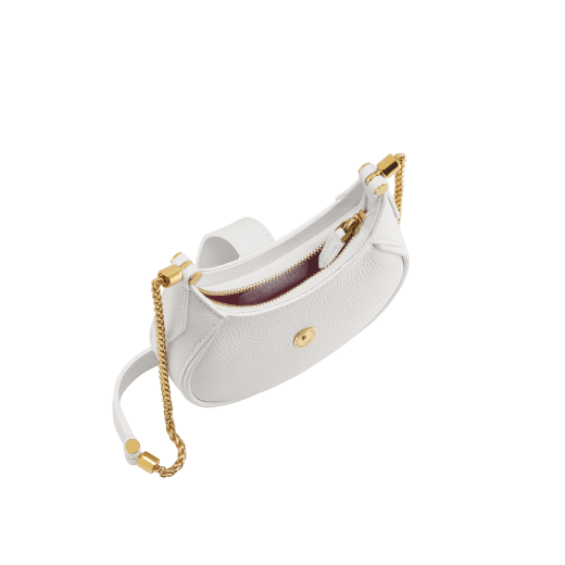 Serpenti Ellipse micro crossbody bag in soft drummed and smooth flamingo quartz pink calf leather with flamingo quartz pink gros grain lining. Captivating snakehead closure in gold-plated brass embellished with red enamel eyes. Online exclusive color. SEA-MICROHOBOb image 2