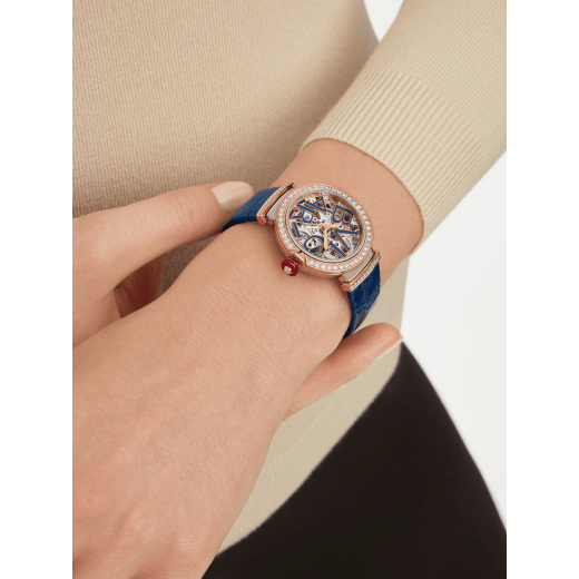 LVCEA Skeleton watch with mechanical manufacture movement, automatic winding and skeleton execution, polished stainless steel case, 18 kt rose gold bezel and links set with diamonds, blue lacquered openwork BVLGARI logo dial and blue alligator bracelet. Water-resistant up to 30 metres 103304 image 1