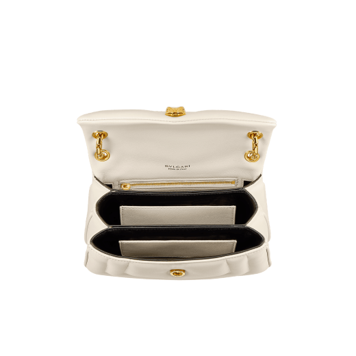 Serpenti Reverse small shoulder bag in ivory opal quilted Metropolitan calf leather with black nappa leather lining. Captivating snakehead magnetic closure in gold-plated brass embellished with red enamel eyes. 1244-MCL image 4