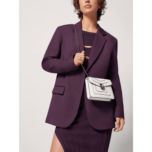 Serpenti Forever small crossbody bag in emerald green calf leather with amethyst purple grosgrain lining. Captivating snakehead closure in light gold-plated brass embellished with black and white agate enamel scales and green malachite eyes. 422-CLa image 5