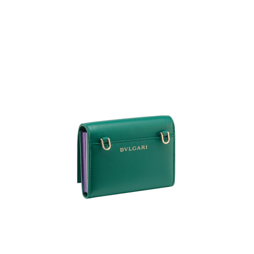 Serpenti Forever crossbody card holder in jade green Metropolitan calf leather with amethyst purple, lavender and sheer amethyst lilac nappa leather side details, and black moiré lining. Captivating magnetic snakehead closure in light gold-plated brass embellished with red enamel eyes. SEACCACCOWSTRAP image 2