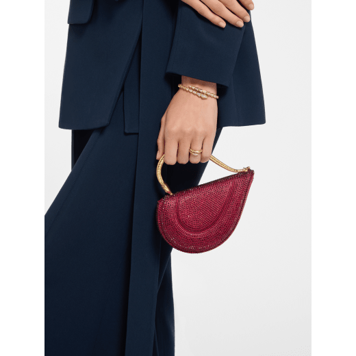 Serpenti Cuoricino mini top handle bag with gold Neige Pavé Crystals applied on a suede base and bright Travertino nappa leather lining. Captivating snake body-shaped top handle in gold-plated brass embellished with engraved scales; press-button closure. SRN-001-1366XS-CRYS image 2