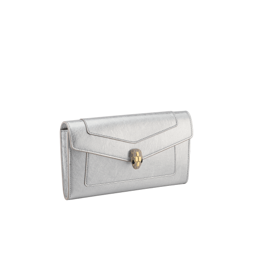 Serpenti Forever large wallet in black calf leather with emerald green nappa leather interior. Captivating snakehead magnetic closure in light gold-plated brass embellished with black enamel and light gold-plated brass scales, and black onyx eyes. SEA-LONG-WLT-R image 1
