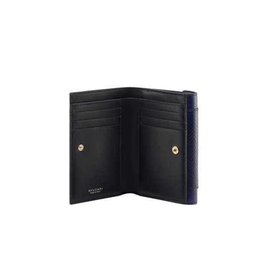 Serpenti Forever compact wallet in midnight plum shiny karung with black nappa leather interior. Captivating snakehead press-button closure in palladium-plated brass embellished with midnight plum enamel and palladium-plated brass scales, and black enamel eyes. SEA-FLAP-POCHETTER-kar image 2