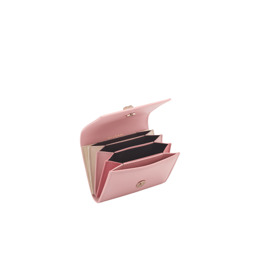 Serpenti Forever crossbody card holder in primrose quartz pink Metropolitan calf leather with flamingo quartz pink, primrose quartz pink and ivory opal nappa leather side details, and black moiré lining. Captivating magnetic snakehead closure in light gold-plated brass embellished with red enamel eyes. 292837 image 2