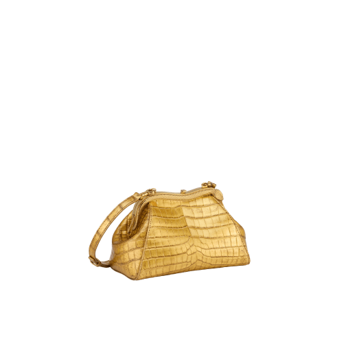Serpentine small pouch in antique gold soft metallic crocodile skin with 24 kt gold treatment and emerald green nappa leather lining. Captivating snake-shaped frame in gold-plated brass including 3 µ of 24 kt gold, embellished with engraved scales and red enamel eyes on one side and antique gold soft metallic crocodile insert on the other, and press-button closure. Exclusive Bulgari 50th anniversary in the US Edition. 292591 image 2