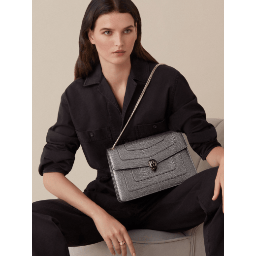 “Serpenti Forever” shoulder bag in Charcoal Diamond grey metallic karung skin with Charcoal Diamond grey nappa leather internal lining. Tempting snakehead closure light gold plated brass enriched with black and glitter Hawk's Eye grey enamel and black onyx eyes. 1089-MK image 3