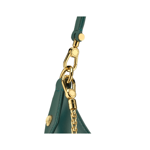 Serpenti Ellipse medium shoulder bag in Urban grain and smooth ivory opal calf leather with flamingo quartz pink gros grain lining. Captivating snakehead closure in gold-plated brass embellished with black onyx scales and red enamel eyes. 1190-UCL image 5