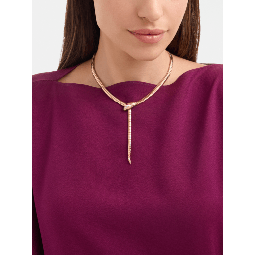 Serpenti 18 kt rose gold necklace set with round rubies on the head and tail, demi pavé diamonds on the head and black onyx eyes 362427 image 1