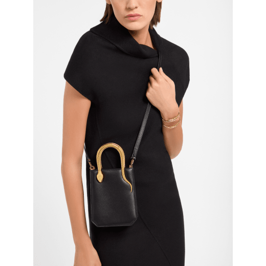 Serpentine mini tote bag in ivory opal Metropolitan calf leather with black nappa leather lining. Captivating snake body-shaped handles in gold-plated brass embellished with engraved scales and red enamel eyes. SRN-1223-CL image 1
