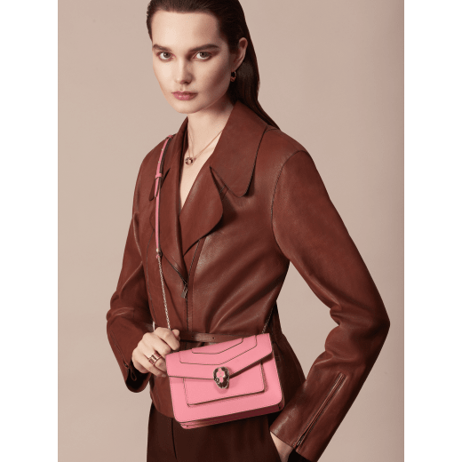 “Serpenti Forever” crossbody bag in Lavender Amethyst lilac calf leather, and Reef Coral red grosgrain inner lining. Iconic snakehead closure in light gold-plated brass enhanced with black and white agate enamel, with green malachite eyes. 1082-CLb image 5