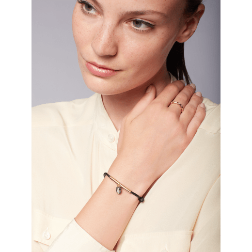 Serpenti Forever bracelet in mimetic jade green fabric. Gold-plated brass tubular element and captivating snakehead charm embellished with black and white agate enamel scales, and black enamel eyes. SERP-MINISTRINGe image 2