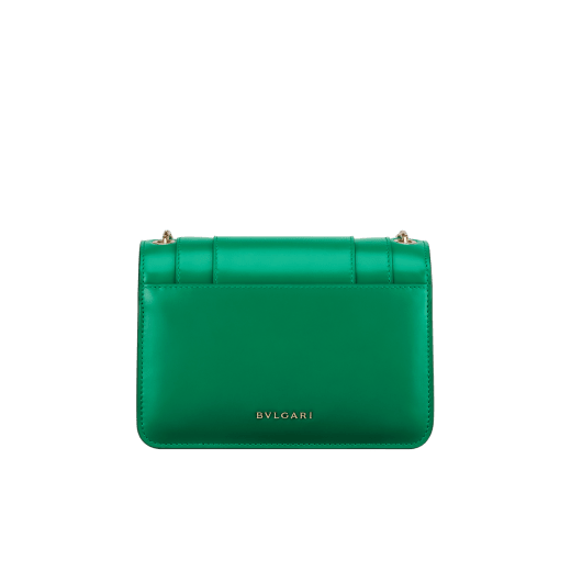 Serpenti Forever small crossbody bag in white agate calf leather with heather amethyst fuchsia grosgrain lining. Captivating snakehead closure in light gold-plated brass embellished with black and white agate enamel scales and green malachite eyes. 1082-CLb image 3