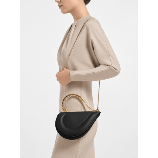 Serpenti Cuore 1968 medium top handle bag in black calf leather with black nappa leather lining. Captivating snake body-shaped top handle in gold-plated brass embellished with engraved scales and zirconia eyes; press-button closure. 294670 image 1