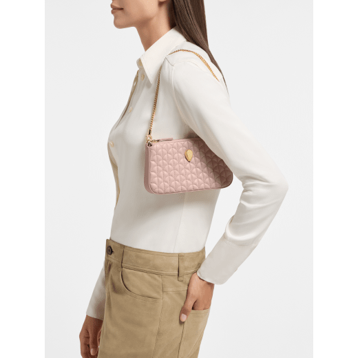 Serpenti Sugarloaf chain clutch in royal ruby Calla Matelassé calf leather with a quilted pattern, royal ruby nappa leather lining and a zipped closure. Captivating snakehead rivet in gold-plated brass finished with red enamel eyes. SSL-CHAINCLUTCH image 1