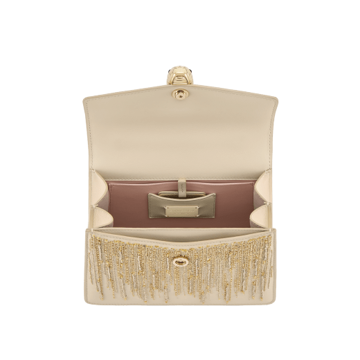 Serpenti Forever medium top handle bag in ivory opal Ray of Light calf leather with crystal rose pink nappa leather lining. Captivating snakehead magnetic closure in light gold-plated brass embellished with ivory opal enamel and light gold-plated brass scales, and black onyx eyes. 293861 image 4