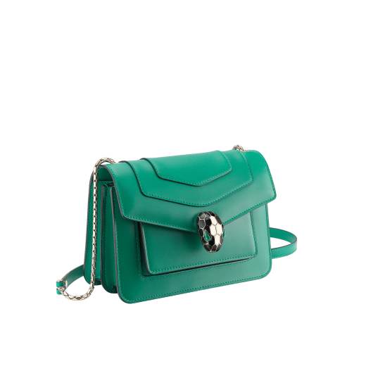 Serpenti Forever small crossbody bag in emerald green calf leather with amethyst purple grosgrain lining. Captivating snakehead closure in light gold-plated brass embellished with black and white agate enamel scales and green malachite eyes. 1082-CLa image 2