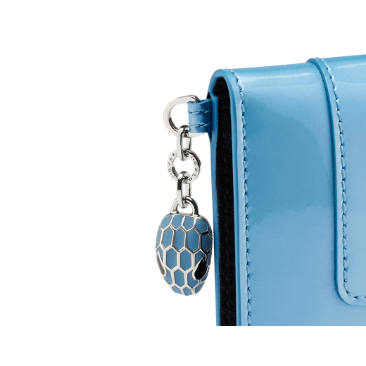 Serpenti Forever bifold card holder in Niagara sapphire blue calf leather with a varnished and pearled effect and black calf leather interior. Captivating palladium-plated brass snakehead charm embellished with matte Niagara sapphire blue enamel scales and black enamel eyes. SEA-CC-HOLDER-FOLD-VCLb image 4