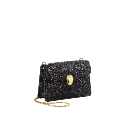 Serpenti Forever mini crossbody bag in natural suede with different-size gold crystals and black nappa leather lining. Captivating magnetic snakehead closure in gold-plated brass embellished with "diamantatura" engraving on the scales and black onyx eyes. 986-CDS image 2