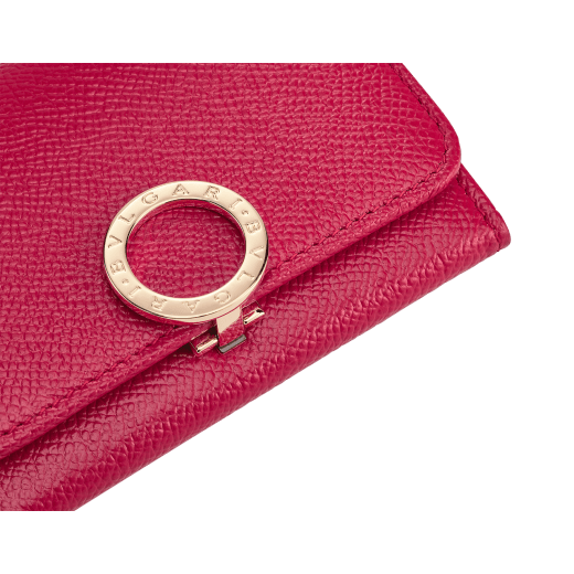 Business card holder in ruby red bright grain calf leather, desert quartz nappa and fuxia nappa lining. Iconic brass light gold plated clip featuring the BVLGARI BVLGARI motif. 579-BC-HOLDER-BGCLa image 4