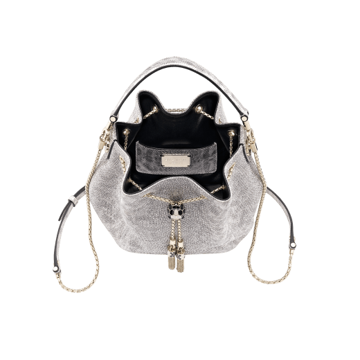 Serpenti Forever bucket bag in Niagara sapphire blue metallic karung skin with Niagara sapphire blue nappa leather lining. Captivating snakehead closure in dark ruthenium-plated brass embellished with matt and shiny black enamel scales and black onyx eyes. 934-MK image 4