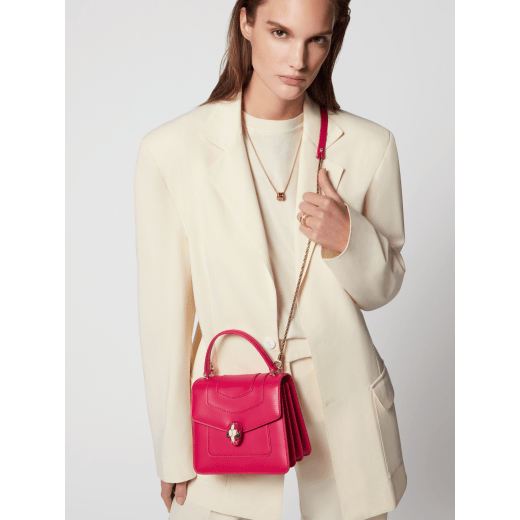 “Serpenti Forever ” top-handle bag in Lavender Amethyst lilac calf leather with Reef Coral red grosgrain inner lining. Iconic snakehead closure in light gold-plated brass embellished with black and white agate enamel and green malachite eyes 1122-CLb image 7
