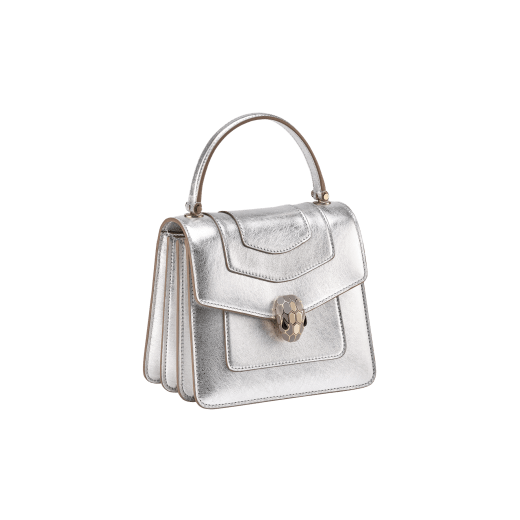 Serpenti Forever small top handle bag in white agate calf leather with heather amethyst fuchsia grosgrain lining. Captivating snakehead closure in light gold-plated brass embellished with black and white agate enamel scales and green malachite eyes. 1122-CLa image 2