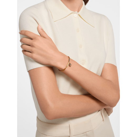 Serpenti Forever bracelet in mimetic jade green fabric. Gold-plated brass tubular element and captivating snakehead charm embellished with black and white agate enamel scales, and black enamel eyes. SERP-MINISTRINGe image 1