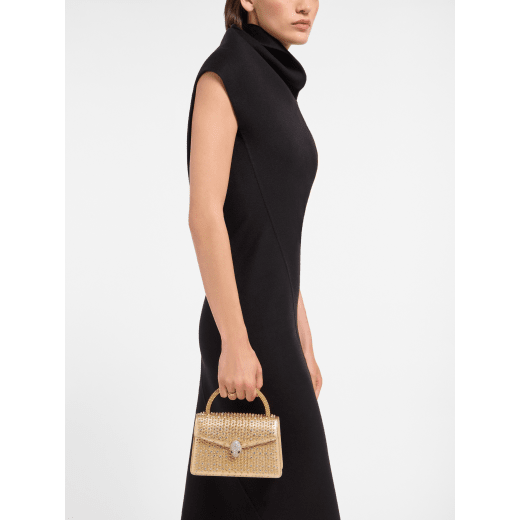 " Serpenti Pallini mini top handle bag with gold-plated brass elements embroidered on gold Liquid Metal calfskin. Captivating gold-plated brass Pallini handle and snakehead magnetic closure in gold-plated brass, embellished with full pavé zirconia and black onyx eyes." 294799 image 1