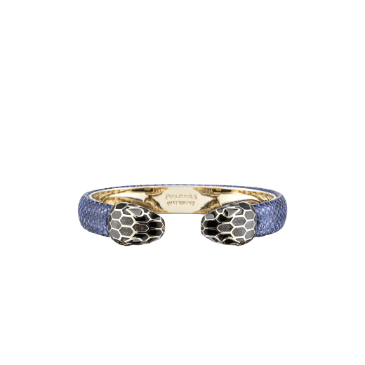 "Serpenti Forever" bangle in metallic Midnight Sapphire blue karung skin with light gold-plated brass details. Iconic face-to-face snakeheads with black and glittery Hawk's Eye grey enamel and seductive black enamel eyes. SPContr-MK-MidSapph image 1