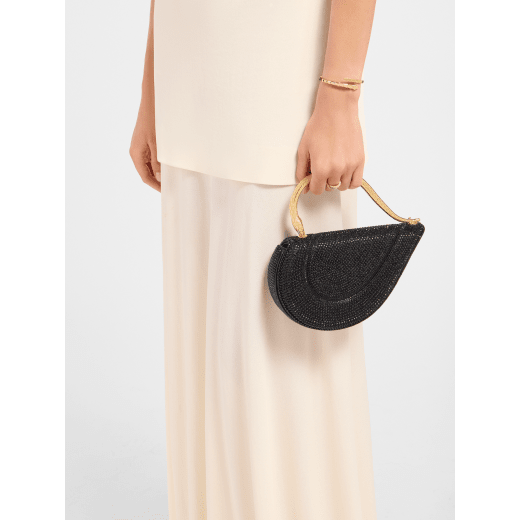 Serpenti Cuore 1968 top handle bag with gold Neige Pavé Crystals applied on a suede base and bright travertino nappa internal lining. Captivating snake body-shaped top handle in gold-plated brass embellished with engraved scales and zirconia eyes; press-button closure. SRN-001-1326S-CRYS image 1