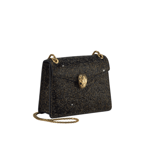 Serpenti Forever Day-to-Night small shoulder bag with black crystals inserts hand-set on suede leather with black nappa leather lining. Captivating snakehead magnetic closure in gold-plated brass embellished with black zirconia pavé and gold-plated brass scales, and black onyx eyes. 294042 image 2