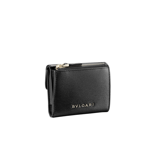 "Serpenti Forever" slim compact wallet in black calf leather and black goatskin. Iconic light gold plated brass snakehead stud closure in black enamel, with black onyx eyes. SEA-SLIMCOMPACT-Cla image 3