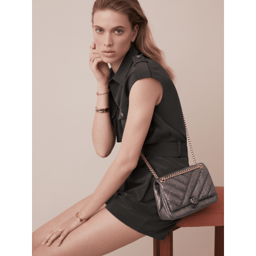 Serpenti Cabochon shoulder bag in soft matelassé charcoal diamond metallic karung skin with graphic motif. Snakehead closure in light gold plated brass decorated with matte black and glitter charcoal diamond enamel, and black onyx eyes. 981-MK image 5