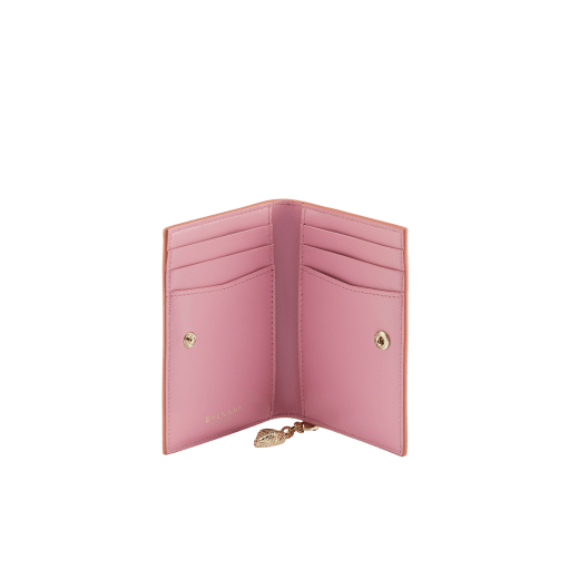 Serpenti Forever folded card holder in coral carnelian orange calf leather with flamingo quartz pink nappa leather interior. Captivating light gold-plated brass snakehead charm with red enamel eyes, and press-stud closure. SEA-CC-HOLDER-FOLD-Cla image 2